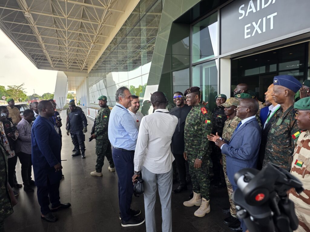 The delegation outside the new passenger terminal of Osvaldo Vieira International Airport